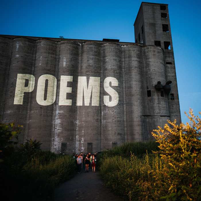 poems projected onto grain silos 2023