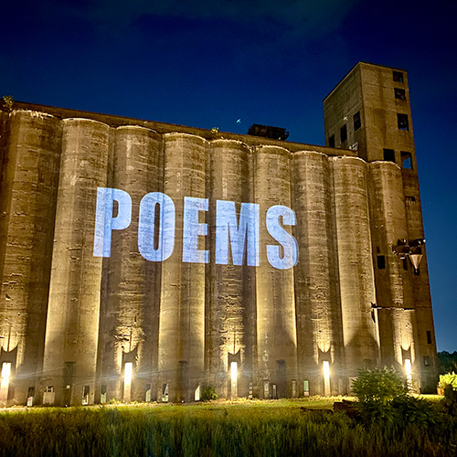 poems projected July 2025 photo credit Noah Falck 500x500 poems projected July 2025 photo credit Noah Falck 500x500