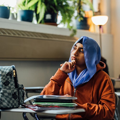 Pondering student photo credit Pat Cray 500x500-min Pondering student photo credit Pat Cray