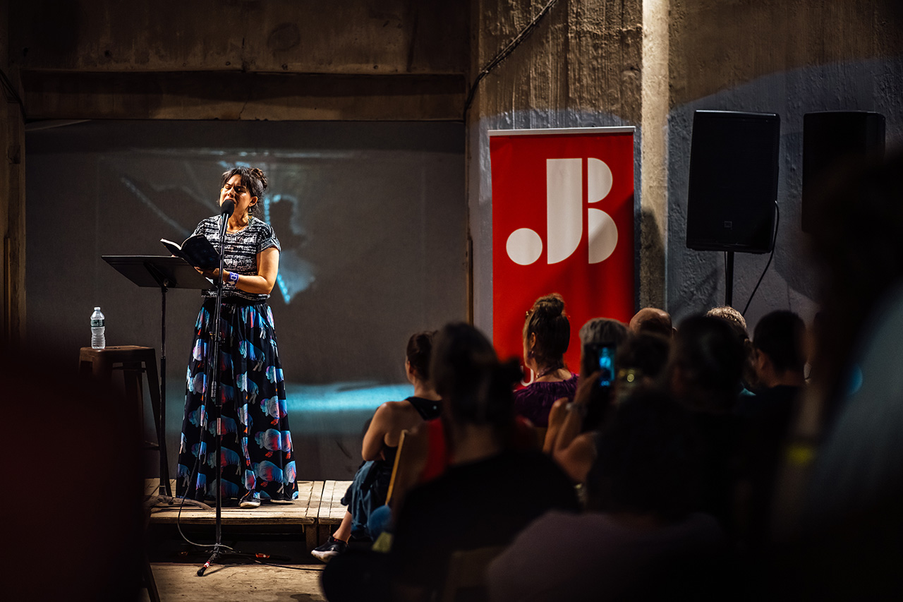 Kenzie Allen reading at the silo city reading photo credit Pat Cray 7262025