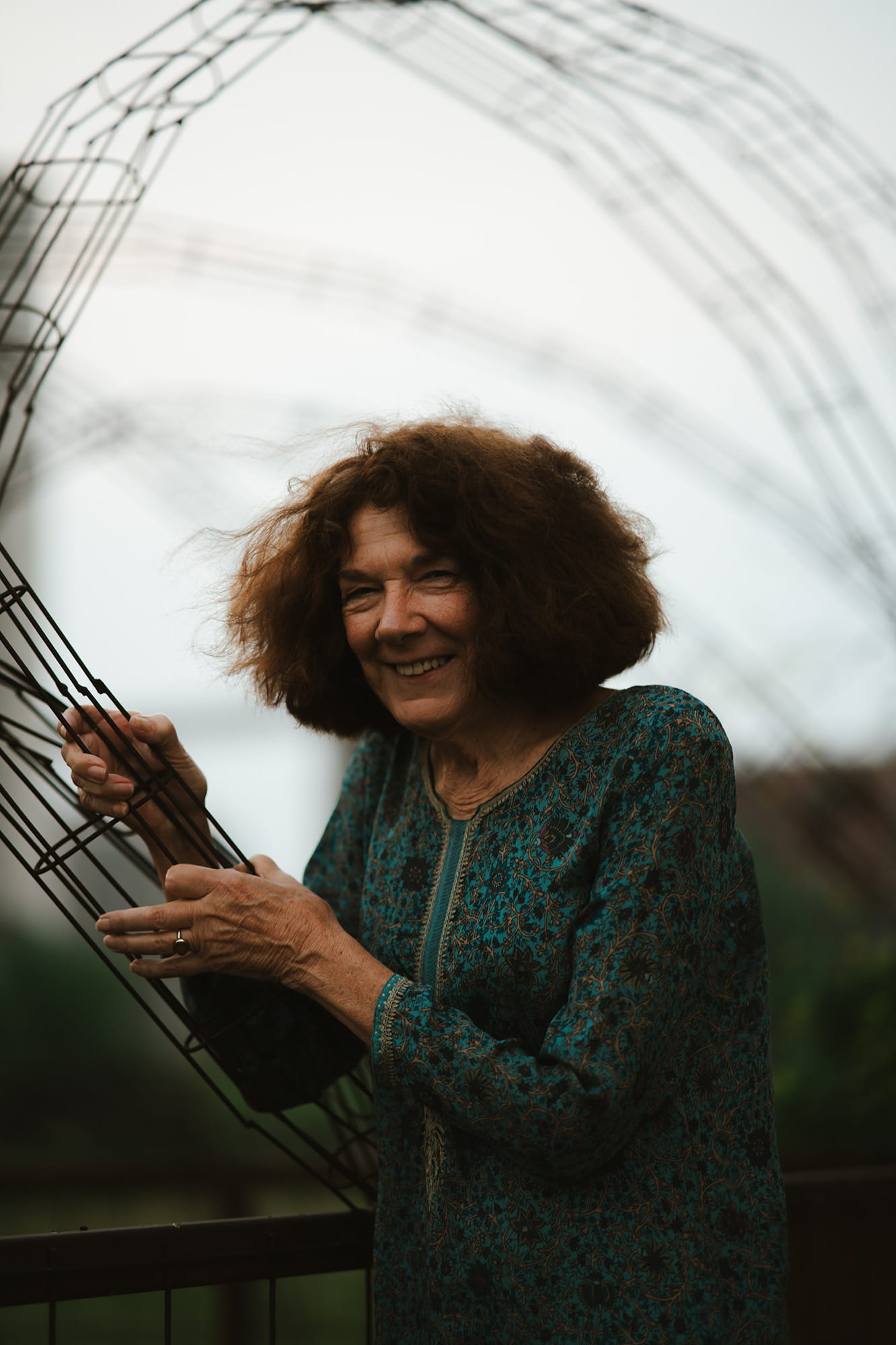 Mary Ruefle portrait holding steel // photo credit Pat Cray