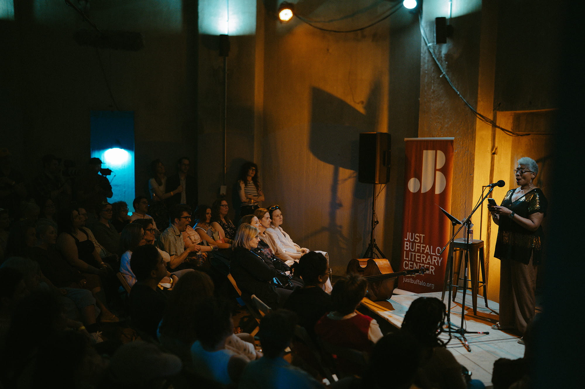 Annette Daniel Taylor and audience at Silo City Reading Series photograph by Pat Cray 6.27.2026